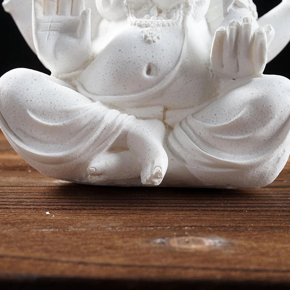 Ganesha Elephant God Statue in Sandstone or Resin (White). Perfect for meditation and home decor.