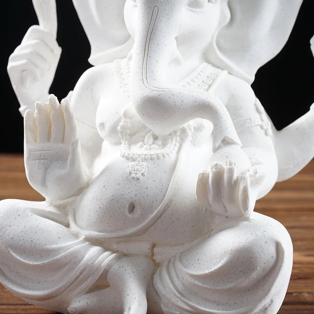 Ganesha Elephant God Statue in Sandstone or Resin (White). Perfect for meditation and home decor.